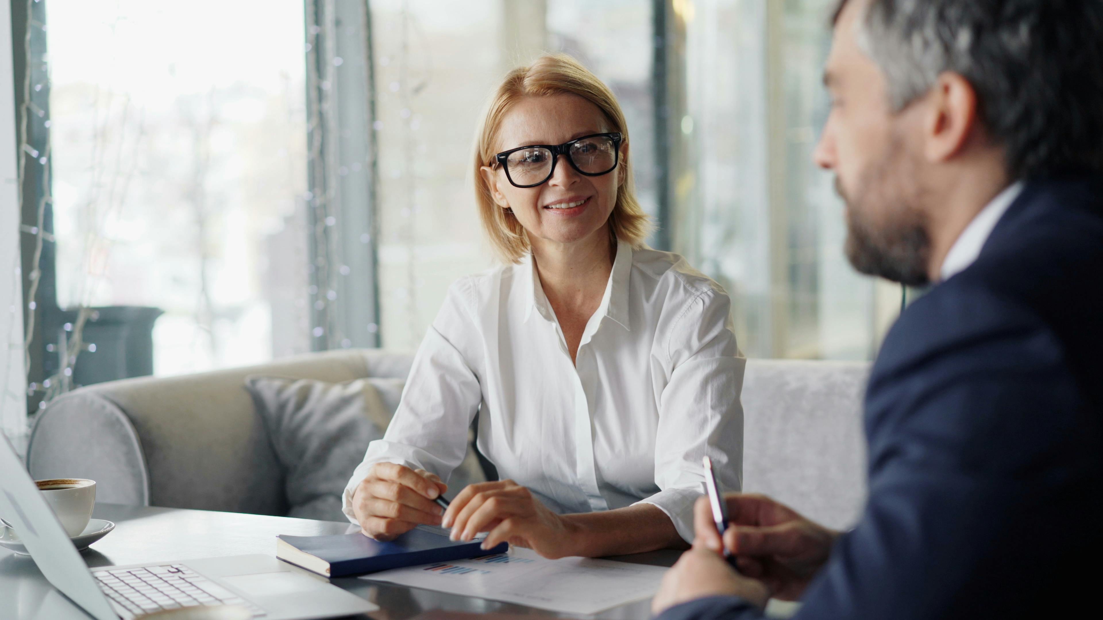 Consultants meeting with a client